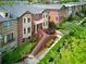 Stunning aerial view of brick townhouses surrounded by manicured landscaping and lush greenery at 2808 Broughton Se Ln, Atlanta, GA 30339