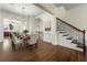 Dining room with hardwood floors and staircase with wrought iron banister at 2808 Broughton Se Ln, Atlanta, GA 30339