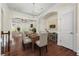Open concept dining room with hardwood floors and decorative chandelier at 2808 Broughton Se Ln, Atlanta, GA 30339