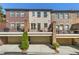 Townhome exteriors featuring brick facades, garages, and private balconies for outdoor living at 2808 Broughton Se Ln, Atlanta, GA 30339