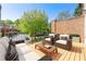 Outdoor patio with wood decking, comfortable seating, and a view of greenery at 2808 Broughton Se Ln, Atlanta, GA 30339
