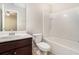 This full bathroom has a shower and tub combination and a vanity with dark cabinets at 362 Lanier Ct, Hiram, GA 30141