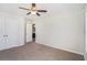 This bedroom features a ceiling fan, a window, and a connected bathroom at 362 Lanier Ct, Hiram, GA 30141