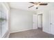Neutral carpeted bedroom features bright windows and a ceiling fan at 362 Lanier Ct, Hiram, GA 30141