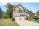 Traditional two-story home with neutral siding and a well-kept lawn on a partly cloudy day at 362 Lanier Ct, Hiram, GA 30141