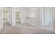 Hallway featuring neutral carpet with doorways leading to bedrooms and stairs at 362 Lanier Ct, Hiram, GA 30141