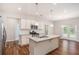Well-lit kitchen with a central island, stainless steel appliances, and hardwood flooring at 362 Lanier Ct, Hiram, GA 30141