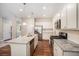 Modern kitchen featuring granite countertops, stainless steel appliances, and ample cabinet space at 362 Lanier Ct, Hiram, GA 30141