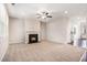 Spacious living room with a cozy fireplace, neutral carpet, and large windows for ample natural light at 362 Lanier Ct, Hiram, GA 30141