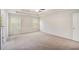 A bright main bedroom shows neutral walls and carpet with a door to the left at 362 Lanier Ct, Hiram, GA 30141