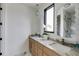Elegant bathroom with double vanity sinks, stylish mirrors, and marble countertops at 3960 Clairmont Rd # 2, Chamblee, GA 30341