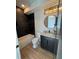 Modern bathroom with black tiled shower/tub and sleek, dark vanity cabinet at 3960 Clairmont Rd # 2, Chamblee, GA 30341