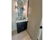 Elegant bathroom with a modern vanity, stylish lighting fixtures, and a granite countertop at 3960 Clairmont Rd # 2, Chamblee, GA 30341