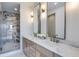 Modern bathroom featuring double sinks with marble countertop and luxurious walk-in shower at 3960 Clairmont Rd # 2, Chamblee, GA 30341