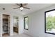 Bright bedroom with ensuite access featuring natural light, modern closet and stylish windows at 3960 Clairmont Rd # 2, Chamblee, GA 30341