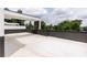 Large rooftop deck, with a view to a lot of green trees and a cloudy sky at 3960 Clairmont Rd # 2, Chamblee, GA 30341