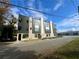 Modern townhome with brick and metal facade, featuring large windows and clean architectural lines at 3960 Clairmont Rd # 2, Chamblee, GA 30341