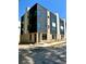 Modern townhome featuring dark metal and brick exterior with large windows at 3960 Clairmont Rd # 2, Chamblee, GA 30341