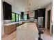 Modern kitchen with stainless steel appliances, marble countertops, and stylish island with seating at 3960 Clairmont Rd # 2, Chamblee, GA 30341