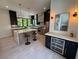 Stylish kitchen with a marble island, stainless appliances, wine cooler, and pendant lighting at 3960 Clairmont Rd # 2, Chamblee, GA 30341