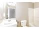 Bright bathroom with a single vanity, toilet, and shower-tub combo at 4153 Island View Ct, Decatur, GA 30034