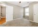 Neutral bedroom featuring a ceiling fan, window and plush carpeting at 4153 Island View Ct, Decatur, GA 30034
