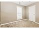 Bedroom features neutral carpet, window, and closet; offers cozy retreat at 4153 Island View Ct, Decatur, GA 30034