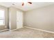 Neutral bedroom featuring a ceiling fan, window and plush carpeting at 4153 Island View Ct, Decatur, GA 30034