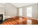Bright living room features hardwood floors, a fireplace, and large windows at 4153 Island View Ct, Decatur, GA 30034