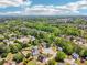 A picturesque aerial view of a lush, green suburban neighborhood with diverse housing styles and landscaping at 1650 Willow River Run, Grayson, GA 30017