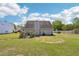 Spacious backyard with a lush lawn, privacy fence, and patio area, ideal for outdoor activities and relaxation at 1650 Willow River Run, Grayson, GA 30017