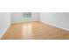 An empty bedroom features wood floors and a window at 1650 Willow River Run, Grayson, GA 30017