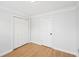 Bedroom offering modern floors, closet with double doors and entry door at 1650 Willow River Run, Grayson, GA 30017