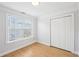 Bedroom featuring modern floors, natural light and closet with double doors at 1650 Willow River Run, Grayson, GA 30017