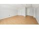 Neutral bedroom offering modern floors, stylish trim and doors to a closet and hall at 1650 Willow River Run, Grayson, GA 30017