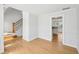 Dining room with hardwood floors and decorative wainscoting adjacent to staircase at 1650 Willow River Run, Grayson, GA 30017