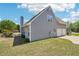 A house with siding, a chimney, and an attached garage at 1650 Willow River Run, Grayson, GA 30017