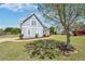 Charming blue home with landscaped front yard and a beautiful mature tree at 1650 Willow River Run, Grayson, GA 30017
