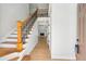 Foyer with hardwood floors, staircase and a view of the living room fireplace at 1650 Willow River Run, Grayson, GA 30017