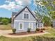 Front exterior showcasing a two-story home with manicured landscaping, a welcoming entrance, and a well-maintained lawn at 1650 Willow River Run, Grayson, GA 30017