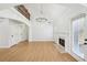 Bright living room featuring hardwood floors, fireplace, and natural light at 1650 Willow River Run, Grayson, GA 30017