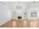 Bright living room featuring hardwood floors, fireplace, and access to the backyard at 1650 Willow River Run, Grayson, GA 30017