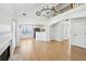 Spacious living room with wood floors, a fireplace, and an open view to the kitchen at 1650 Willow River Run, Grayson, GA 30017