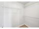 Walk-in closet featuring shelving, storage space and modern floors at 1650 Willow River Run, Grayson, GA 30017