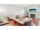 Cozy living room with a fireplace, large TV, hardwood floors, and comfortable seating at 3861 Sunbridge Dr, Snellville, GA 30039