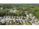 A peaceful aerial view reveals the neighborhood homes surrounded by mature trees and landscaping at 507 Oakleaf Ct, Acworth, GA 30102