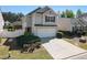 Charming two-story home with attached two-car garage, concrete driveway, and well-maintained landscaping at 507 Oakleaf Ct, Acworth, GA 30102