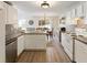 Clean, eat-in kitchen featuring white cabinetry and appliances at 507 Oakleaf Ct, Acworth, GA 30102