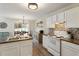 Bright kitchen with stylish backsplash and stainless steel sink at 507 Oakleaf Ct, Acworth, GA 30102
