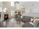 Open living room with high ceilings, fireplace, modern furnishings, and backyard view at 507 Oakleaf Ct, Acworth, GA 30102